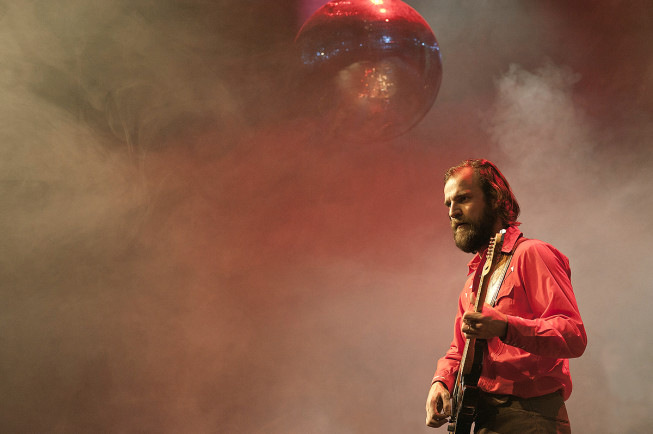 Even when you’re shooting from the back row of a concert without a telephoto lens, try to give it life, for example by composing an interesting object into it. Here I used a hanging disco ball. My lens was an 85mm. (Please The Trees) Photo: Tomáš Bartoš